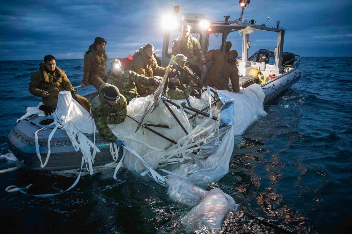 US sailors recover a high-altitude surveillance balloon off the coast of Myrtle Beach, South Carolina, last Sunday (US Navy/AFP/Getty)