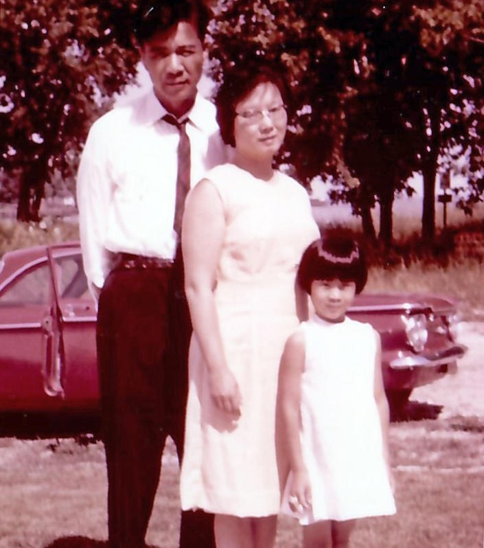 The author as a girl with her parents. (Courtesy Yvonne Liu)