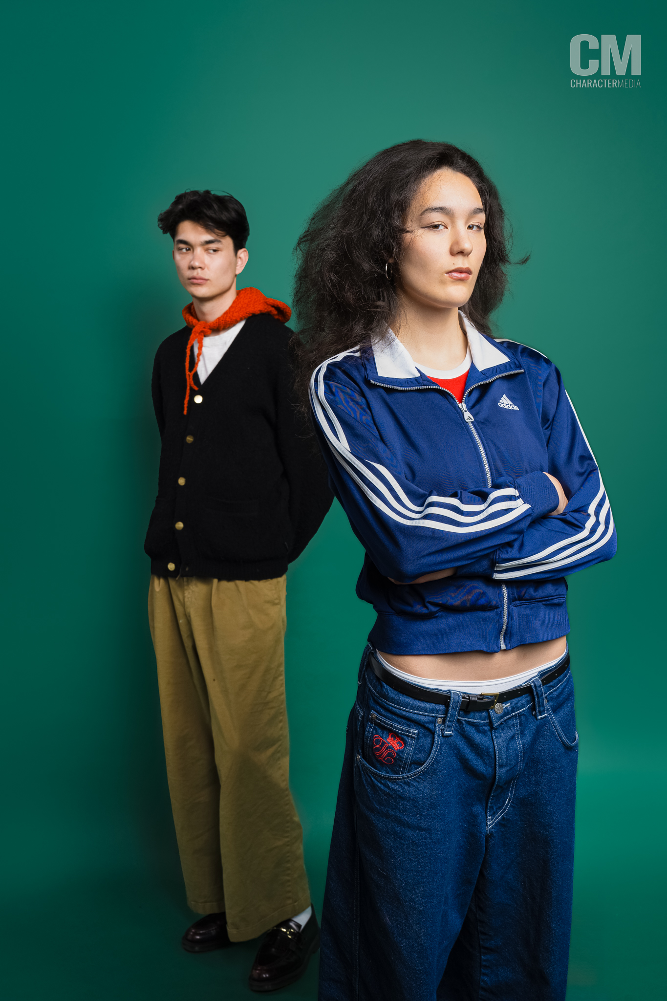 William Gao and Olivia Hardy of Wasia Project pose in front of a green backdrop.